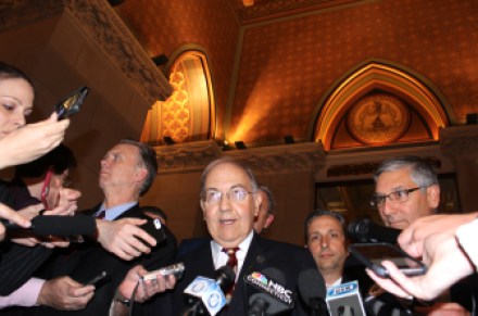 Senate President Pro Tem Martin M. Looney announces the Senate will meet in special session next week to act on the state budget. Behind him on right is Senate Majority Leader Bob Duff and, at far right, Senate Minority Leader Len Fasano.