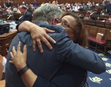 House Speaker J. Brendan Sharkey hugs Rep. Toni Walker, co-chair of the Appropriations Committee, after final passage of the state budget in the House.