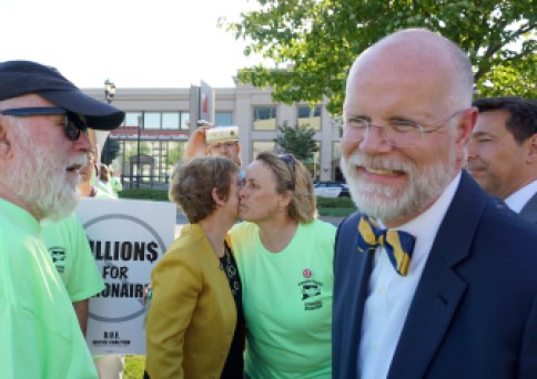Comptroller Kevin Lembo mingled outside. His aide, Martha Carlson, kisses Lori Pelletier, the AFL-CIO president.