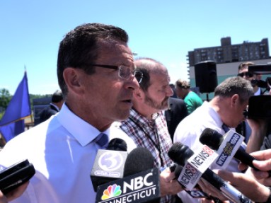 Gov. Dannel P. Malloy talks to reporters.