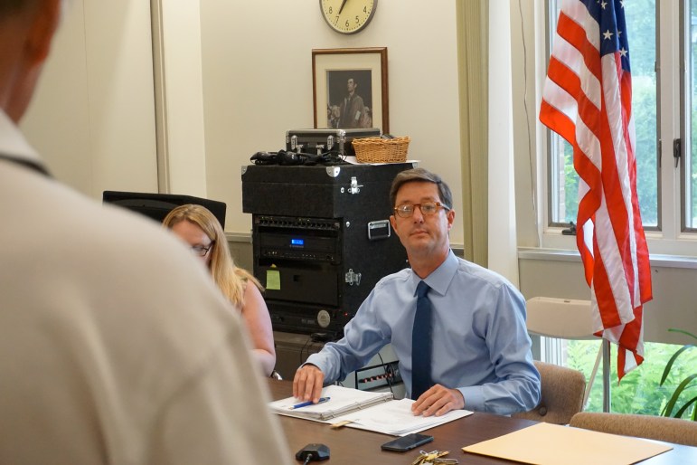 Clay Cope, the first selectman of Sherman, listening to a man concerned about Candlewood Lake.