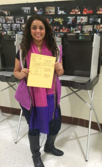 One new American and new voter, Sahar Usmani-Brown, with her ballot in New Haven on April 26