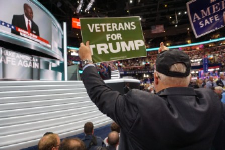 Charles Bruckerhoff of Chaplin, a Vietnam vet, waves a sign.