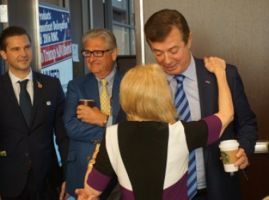 Trump's campaign manager, Paul Manafort is greeted by a delegate during his visit to the Connecticut delegation breakfast. Laurie Gay, who runs a Trump superPAC, is at left. Read the story here.