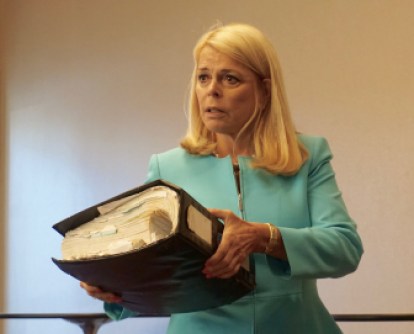 Betsy McCaughey and her copy of Obamacare.