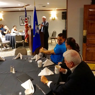 U.S. Rep. Joe Courtney gestures to tribal leaders Rodney Butler and Kathy Regan-Pyne, who are seated with Chris Dodd.