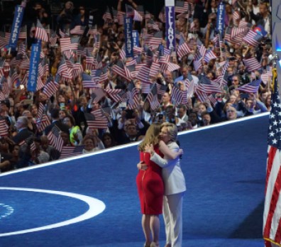Mother and daughter embrace.