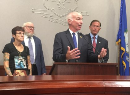 U.S. Rep. Joe Courtney, front, speaks during a press conference. He is joined by Chadwick's mother, Wendy Hartling, and her lawyer, Chester Fairlie, left, and U.S. Sen. Richard Blumenthal, right. (7/25/2016)