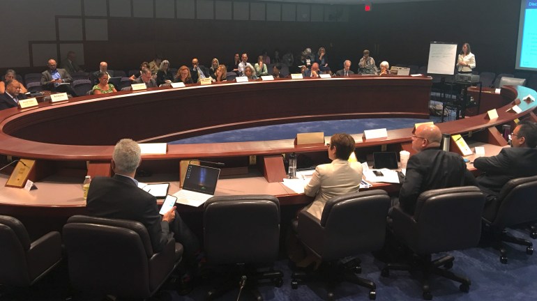 Members of the state's Health Care Cabinet discuss reform options with consultants from Bailit Health Purchasing.