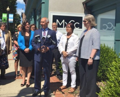 CSCU President Mark Ojakian, flanked by legislators and other college leaders, announces the Meriden campus of Middlesex Community College will stay open