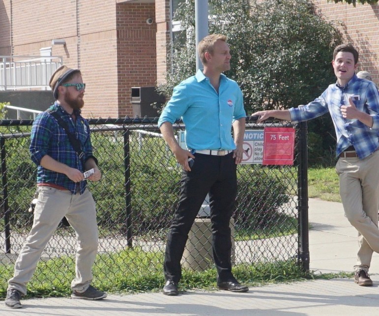 Joshua Elliott, center, at the polls. At left is a Working Families field worker.