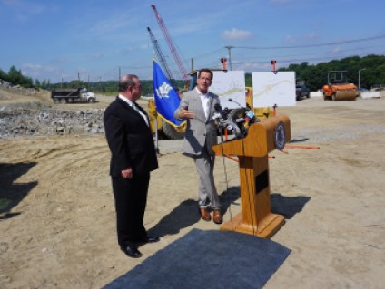 Malloy and Waterbury Mayor Neil O'Leary, standing on what will be part of I-84 in 2019.
