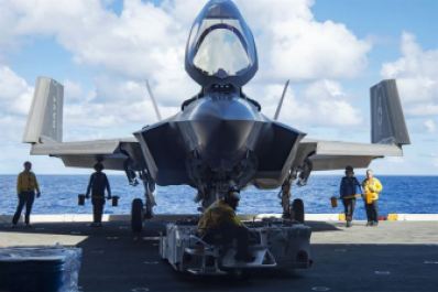 Sailors move an F-35C, the carrier version of the joint strike fighter, during sea trials aboard the USS Dwight D. Eisenhower last year.