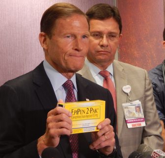 U.S. Sen. Richard Blumenthal holds an EpiPen two-pak box during a press conference in Hartford Wednesday.