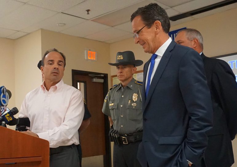 The mood was easier after the meeting as Ganim thanked Malloy. At center is Col. Alaric Fox .