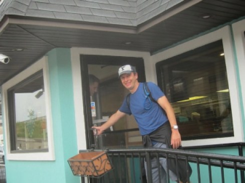 With rain slicker tied around his waist, Murphy arrives at Cody’s for a break.