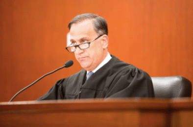 Judge Thomas Moukawsher reading his decision.