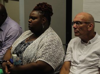 Aymir Holland's mother Latoya Willis and his teacher, Mark Fitzpatrick at a recent community meeting.
