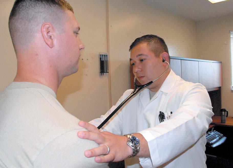 Capt. David Kassop, 22d Chemical Battalion physician, listens to the heartbeat of a patient at the Edgewood Troop Medical Clinic at Aberdeen Proving Ground Sept 13. Photo by Chanel Weaver