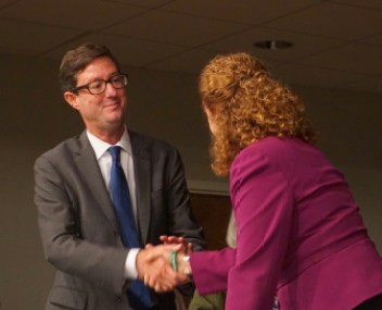 The candidates, who had never met, shake hands at the conclusion of their debate.