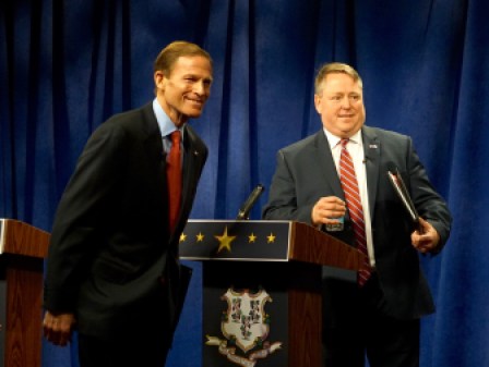 Blumenthal, Carter look to the small studio audience as the debate ends.