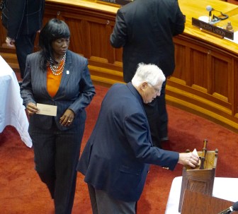 Edward F. Piazza casts an electoral vote as Jeannette Morrison waits.