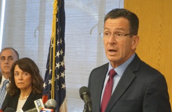 Gov. Dannel P. Malloy with Judeen Wrinn and other staff.