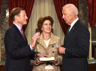 Sen. Richard Blumenthal, left, takes the oath in a ceremonial reenactment of his swearing in with his wife Cynthia and Vice President Joe Biden.
