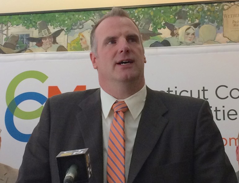 How do CT municipalities adopt, pay for their budgets?