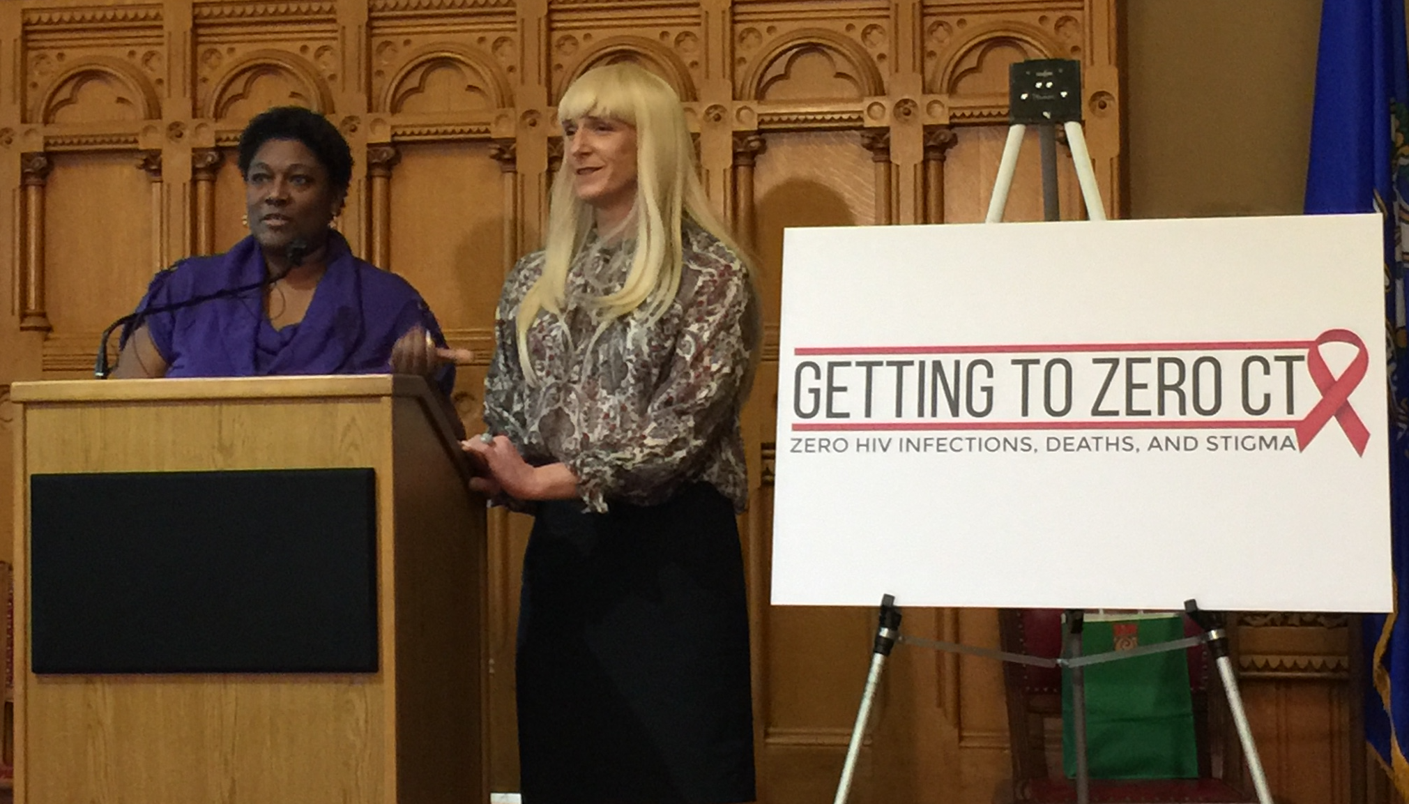 Latoya Tyson and Dr. A.C. Demidont, members of the Getting to Zero Commission speaking at the state capitol building Monday.