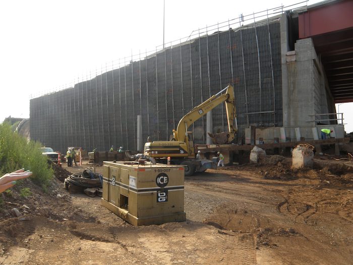 Work at the old Q-Bridge foundation, prior to construction of a retaining wall that would support traffic from I-95 Southbound to I-91 Northbound. (Image courtesy of the State Department of Transportation)