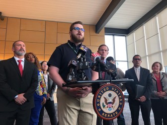 Christopher Scofield, a technician at Bradley International Airport, speaks at the press conference on Monday.