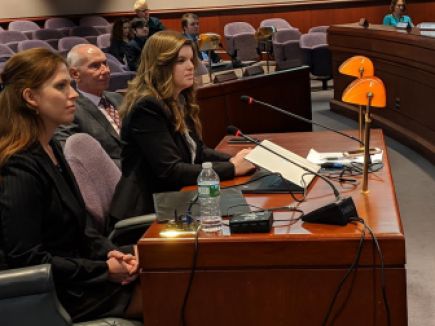 Emsi economists, Anna Brown, left and Hannah Ruffridge present their economic analysis to legislators while CSCU President Mark Ojakian, center, listens.