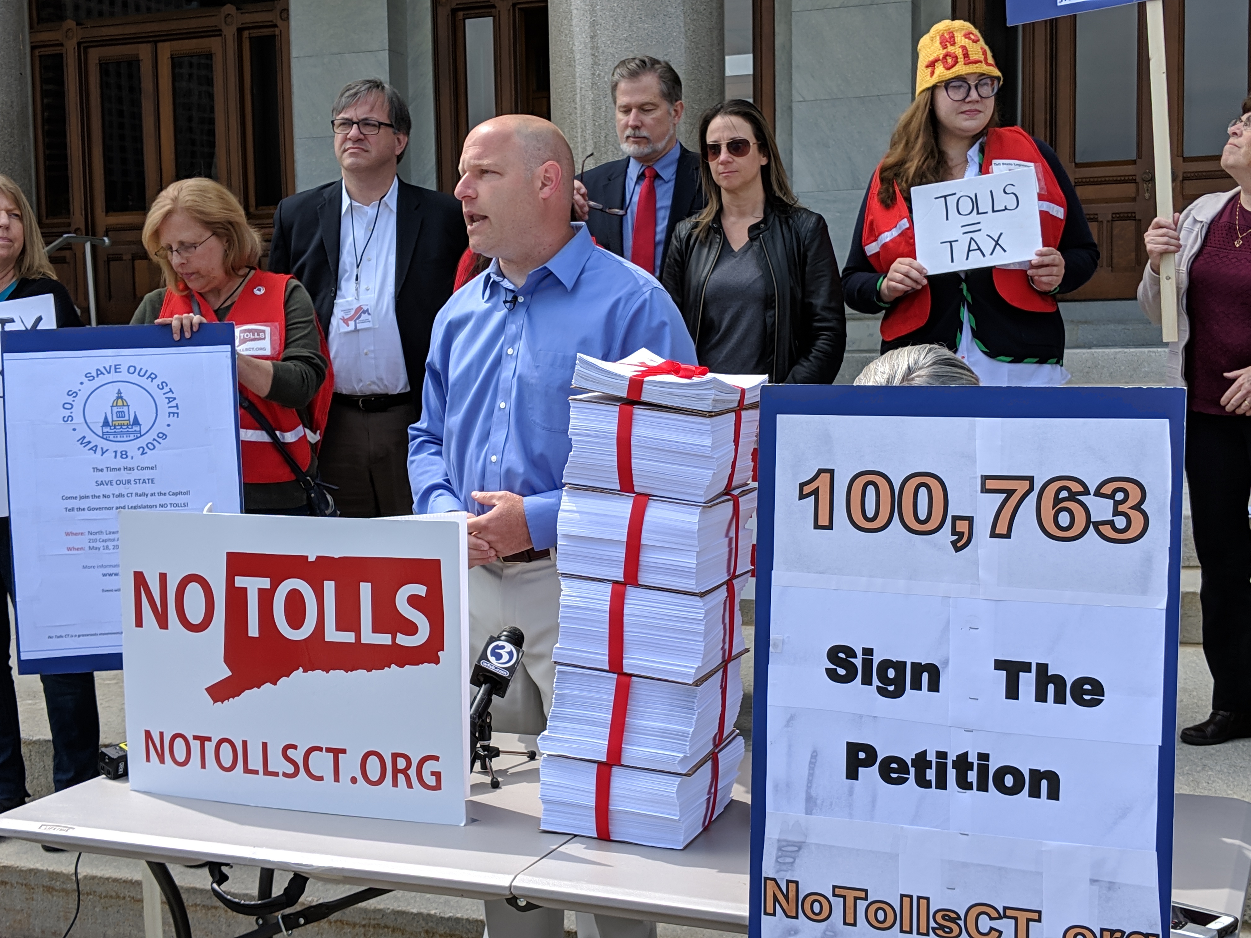 Patrick Sasser, founder and leader of No Tolls CT rallied with a small group of poll opponents at the Capitol Thursday. They delivered petitions with more than 100,000 signatures to the governor's office.