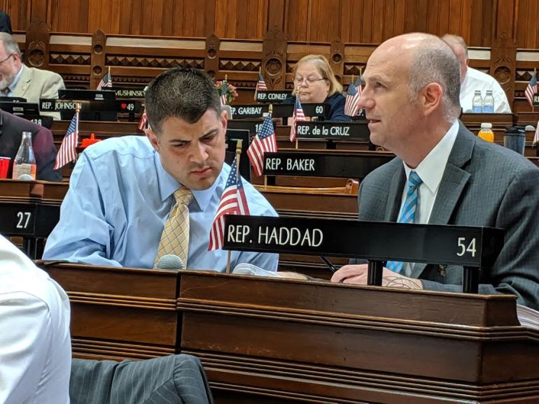 Rep. Gregg Haddad, right, co-chairman of the higher education committee, confers with Rep. Gary Turco.