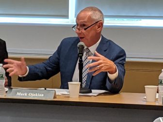 Mark Ojakian, president of the Connecticut State Colleges and Universities system, explains budget details to the board at Thursday's meeting.