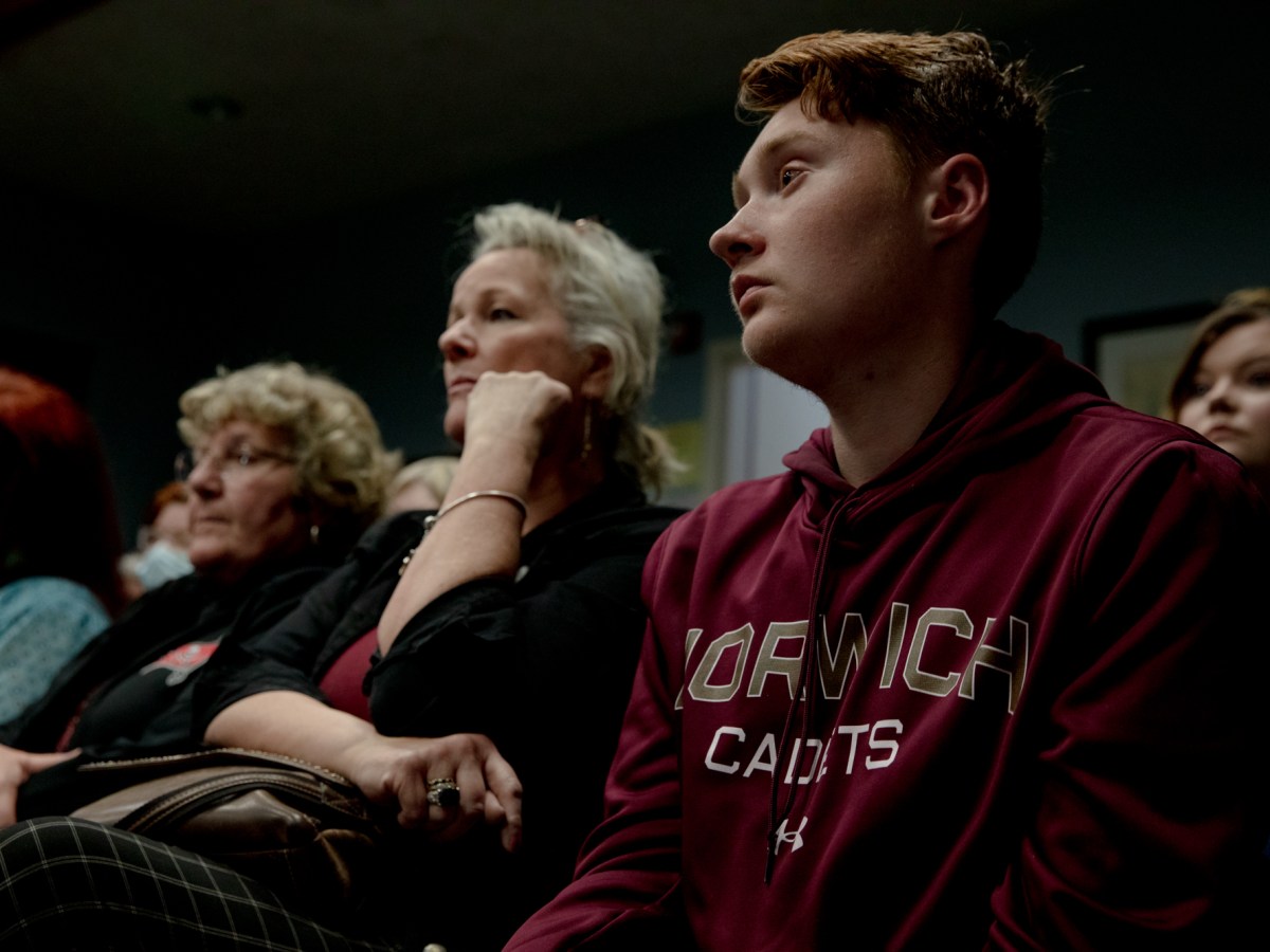 Seth Varin, right, sits with other Killingly residents after giving a public comment to support a free mental health clinic. "I believe you are missing out on a great opportunity to save lives," Varin said.