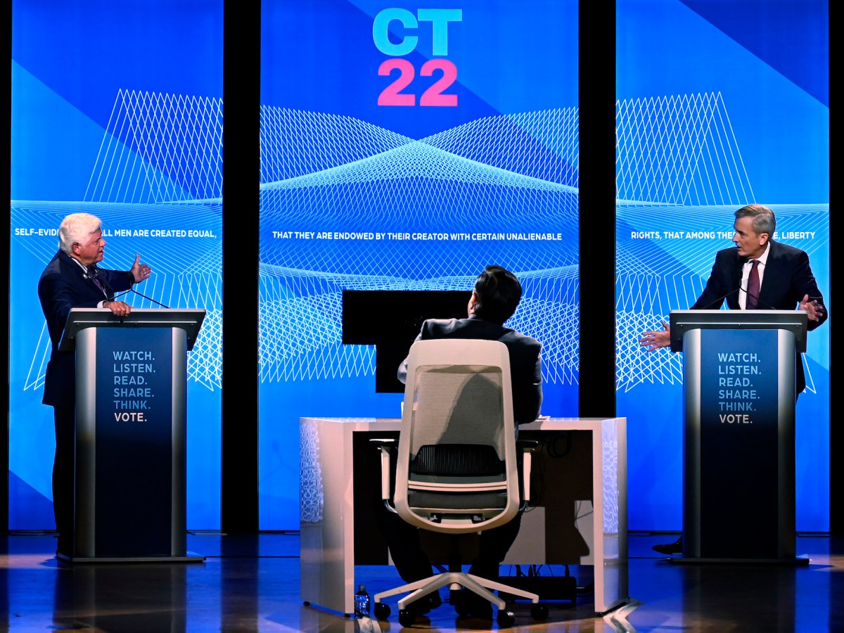 John Larson and Larry Lazor on debate stage