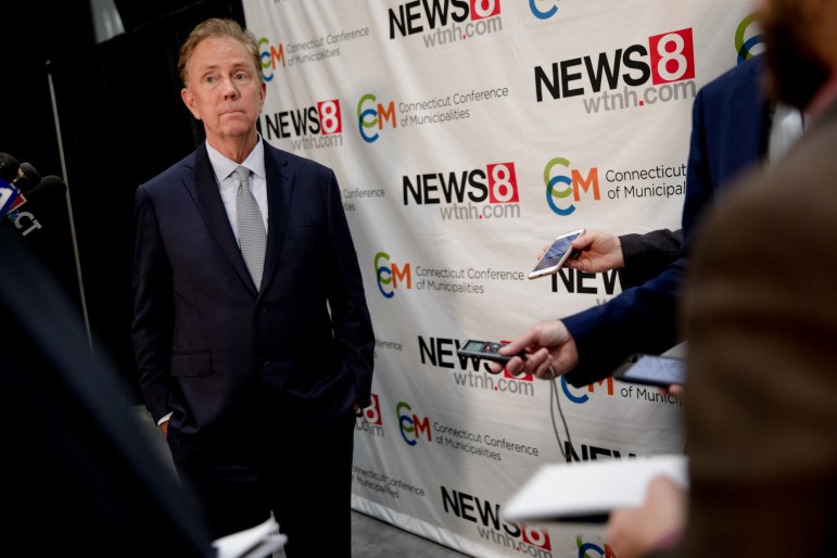 Gov. Ned Lamont answering questions from the press after the debate.
