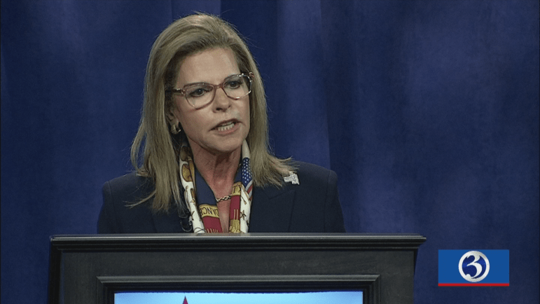 Republican Senate candidate Leora Levy stands the podium during  Wednesday night's televised debate.