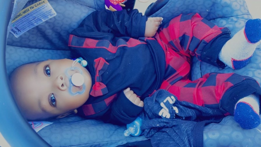 A baby in a car seat.