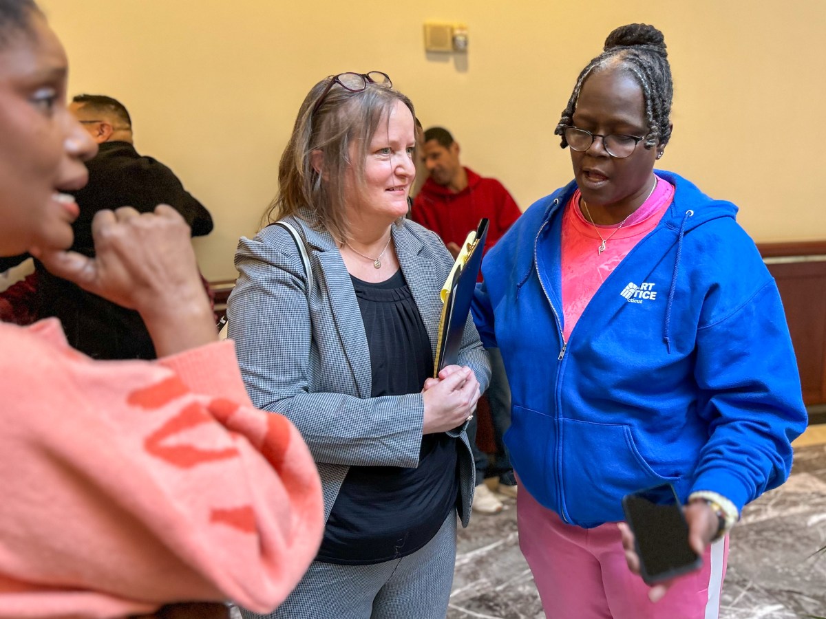 Hilary Carpenter is having a conversation in Hartford's Legislative Office Building.