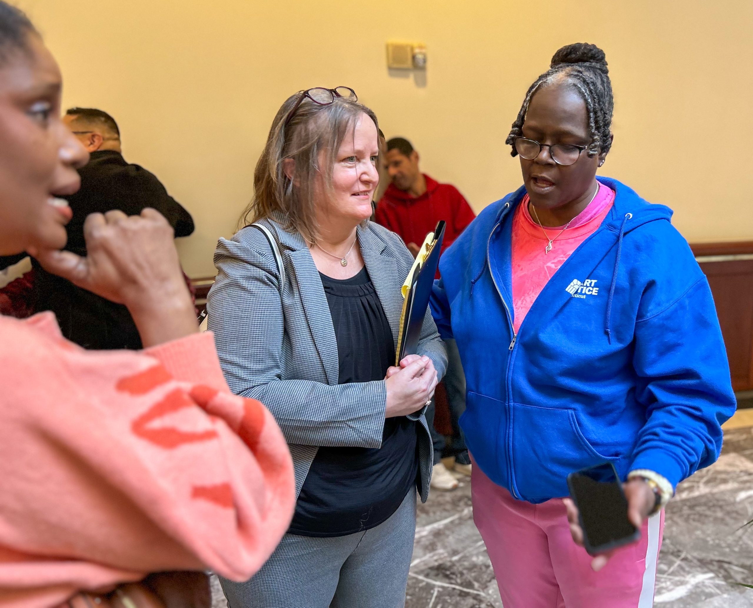 Hilary Carpenter is having a conversation in Hartford's Legislative Office Building.