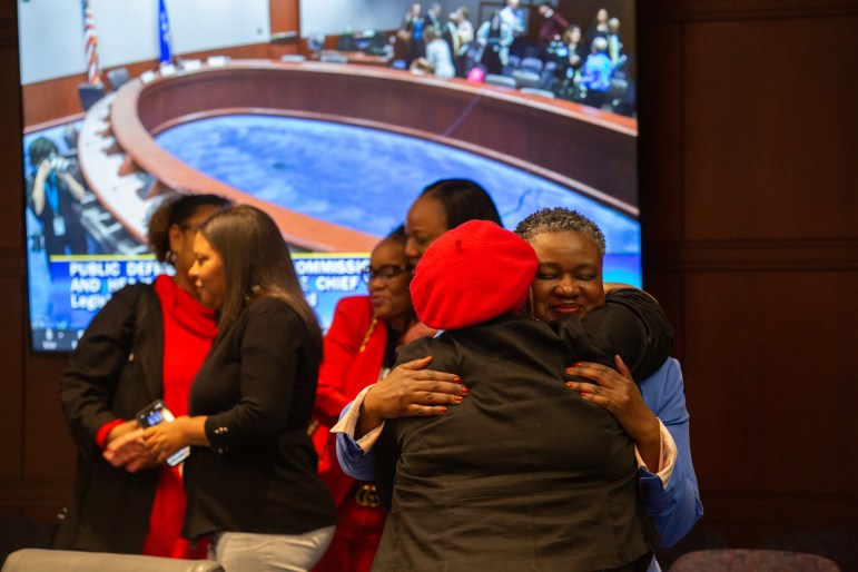 TaShun Bowden-Lewis is hugging one of her supporters