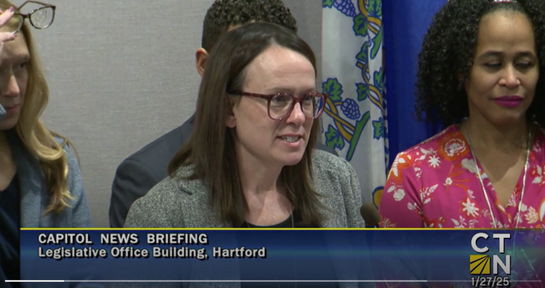 Screenshot of a lawmaker speaking at a press conference.