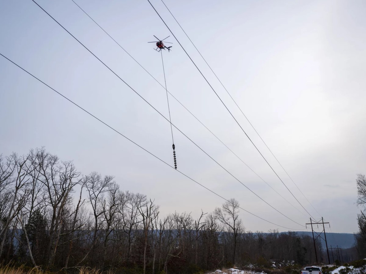 Blade-dangling helicopter chops CT tree limbs to keep power flowing