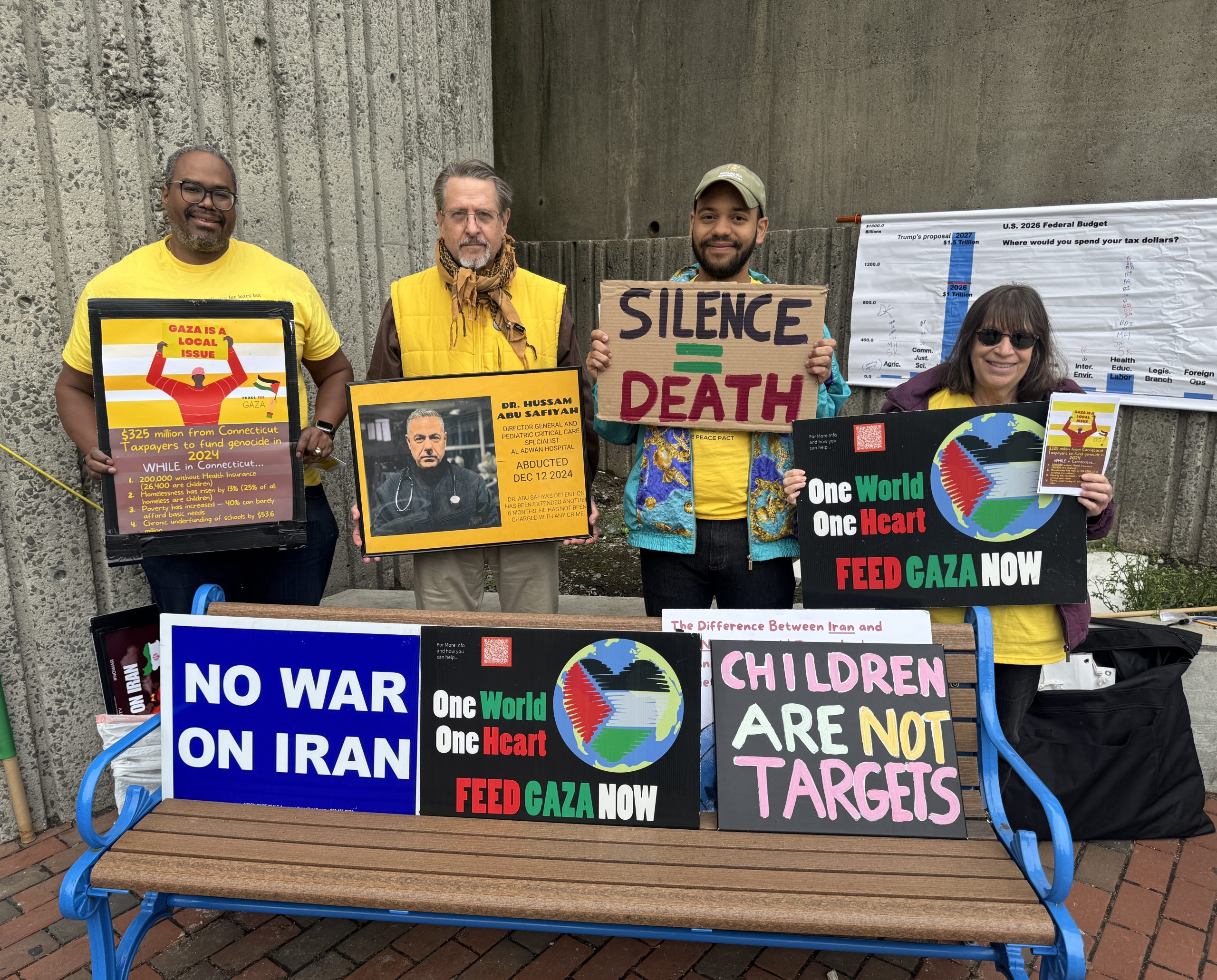 At Bridgeport’s train station, a small group asks residents to pause and think